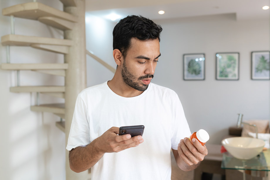 man-looking-at-prescription